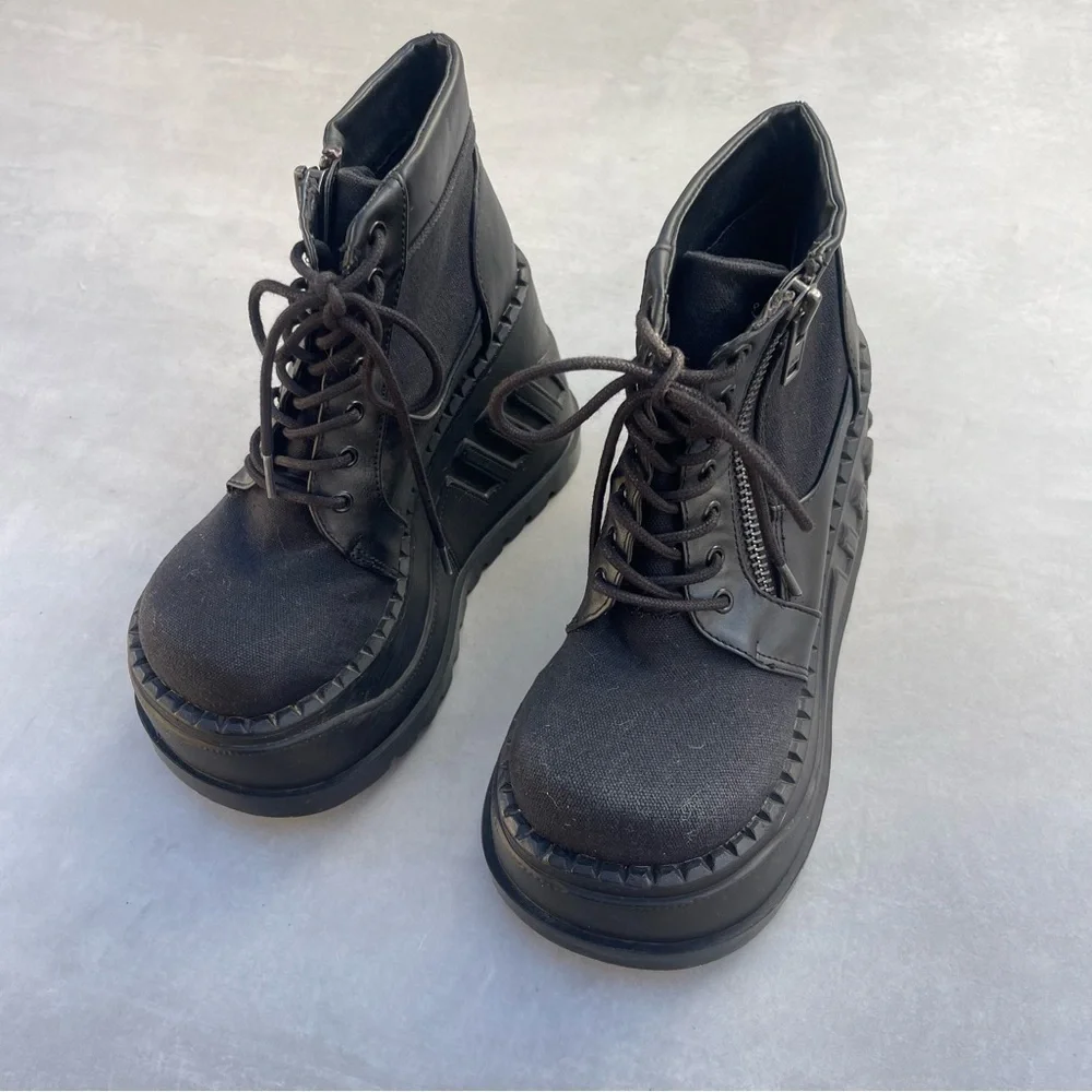 Demonia STOMP-10 Wedge Platform Lace-Up Bootie in Black Canvas